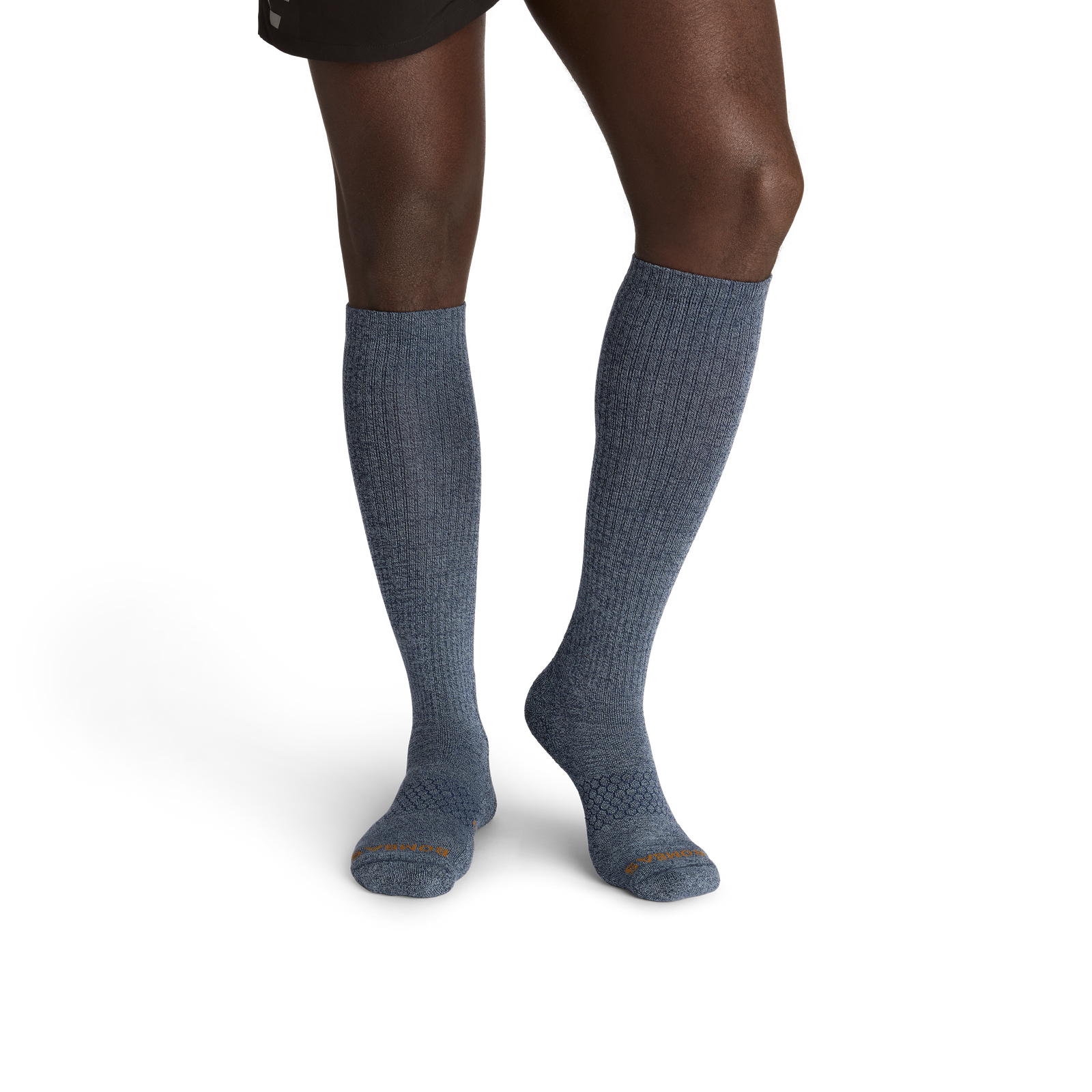 official-bombas::10387-midnightnavy-desertkhaki-adult-male-onmodel-2-transparent-_1_.png